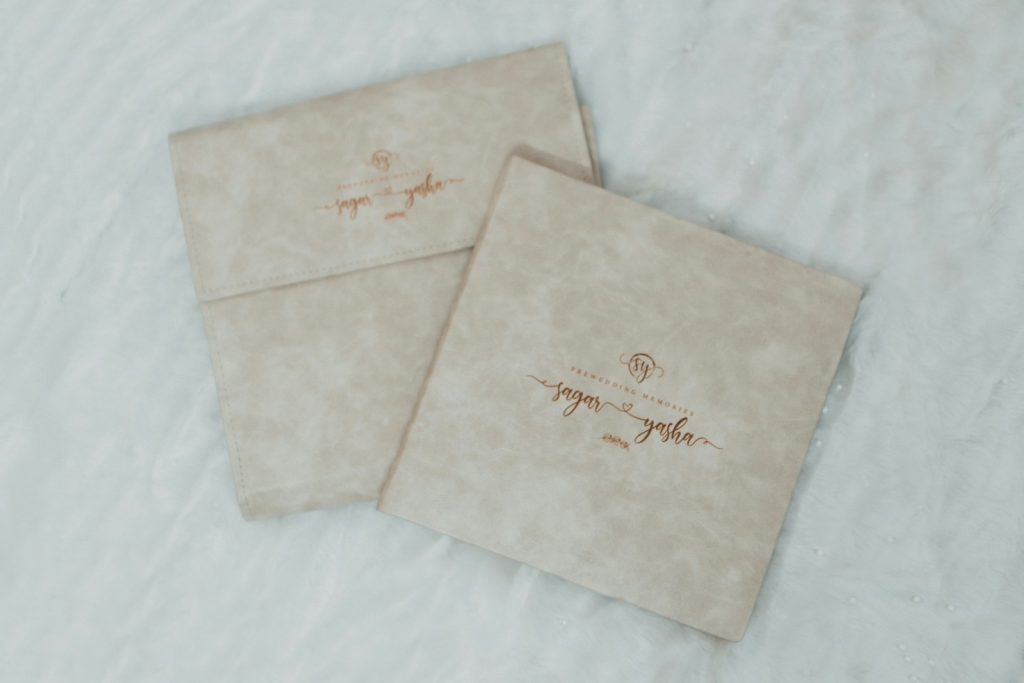 a couple of envelopes sitting on top of a bed